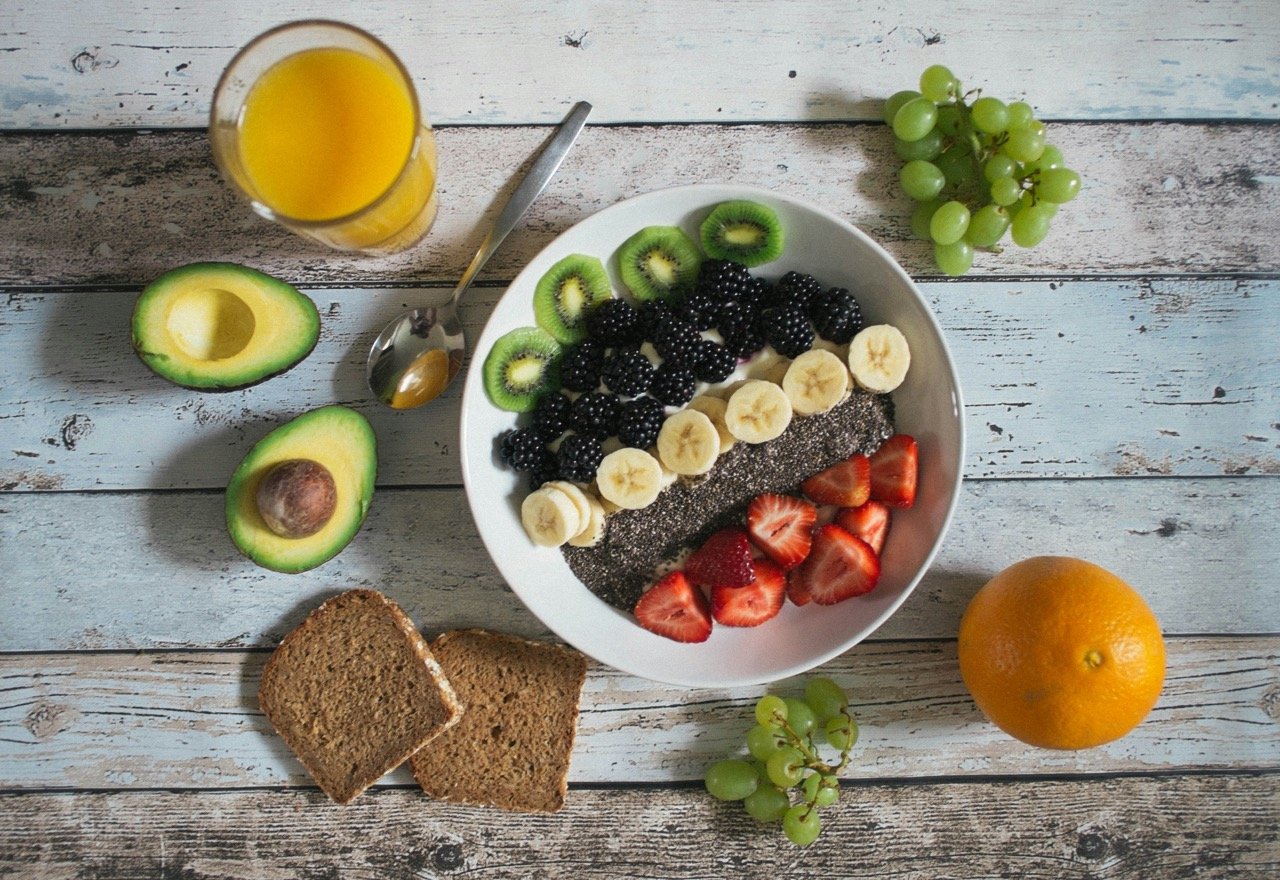 A bowl of fresh fruit including lemons and bananas